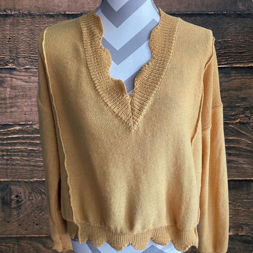 Darling mustard yellow sweater with scalloped detail!